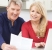Smiling Mature Couple Reviewing Document, estate planning attorney, estate planning terms