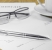 contract business papers pen glasses cup of coffee
