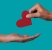 person giving a heart to another person